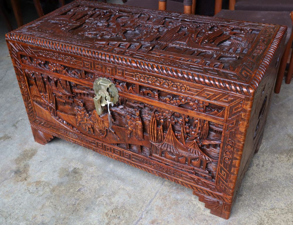A Chinese carved camphorwood trunk, width 100cm depth 50cm height 58cm